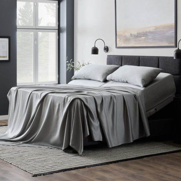 Malouf Botanical Sheet Set With TENCEL™ Lyocell Fiber on a beautiful bed. Sheets in dusk color.