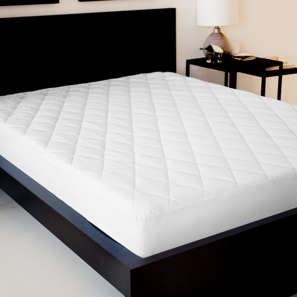 photo of Malouf Mattress Pad on a bed