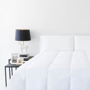 Malouf Woven ™ Down Blend Comforter on bed