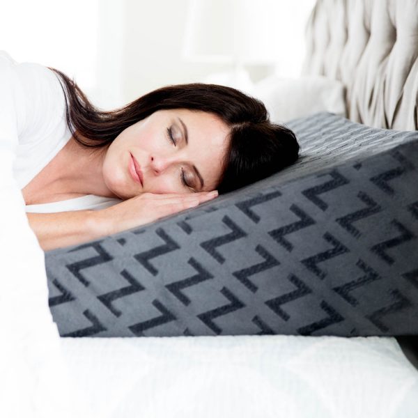 woman sleeping on the Malouf Wedge Pillow with Gel Dough®