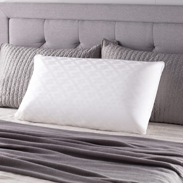 Malouf Zoned Dough® Pillow pictured on bed