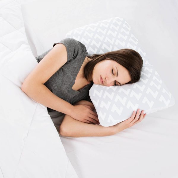 woman sleeping on the Malouf Shoulder Cutout Pillow Zoned Dough® + Chamomile