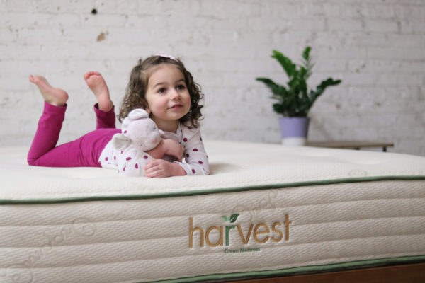little girl lying on a Harvest Vegan Original Mattress